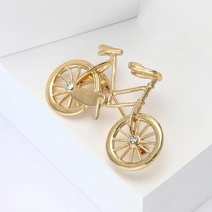 Elegant gold bicycle brooch with white rhinestones for suits and shirts, 45-degree angle