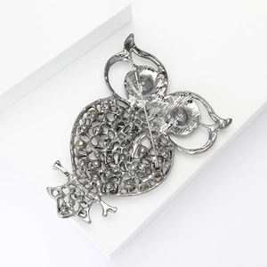Detailed back view of vintage silver hollow owl brooch showing the secure pin fastener