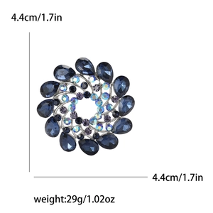 Detailed view of rhinestone flower brooch showing 4.4cm diameter and 29g weight measurements