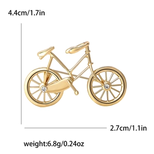 Golden metal bicycle brooch with small white crystal rhinestones for suits