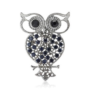 Vintage owl brooch with hollow silver alloy, blue rhinestones, and black eyes with reflection