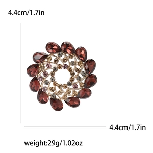 Elegant vintage rhinestone flower brooch with red stones and champagne crystals