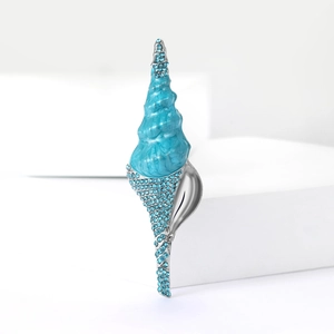 Broche coquillage créative en émail et strass avec texture bleu océan en finition argent