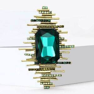 Vintage-Brosche mit großem smaragdgeschliffenem grünem Kristall und Strasssteinen in Gold