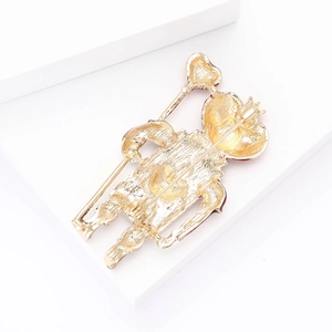 Detailed back view of a gold-toned vintage alloy brooch with secure safety pin clasp