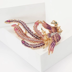 Broche phénix élégante en émail coloré et strass brillants sur une base en métal doré