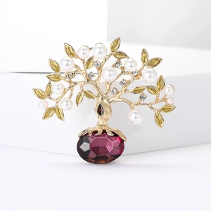 Broche arbre de vie dorée avec perles blanches, strass et grosse pierre violette