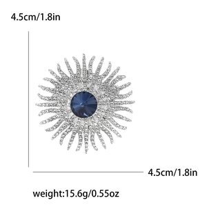 Detail showing elegant sunflower brooch with blue gemstone and dimensions marking