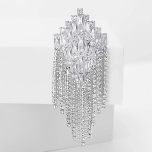 Detail of elegant silver tassel brooch with rhinestone rhombuses and cascading chains