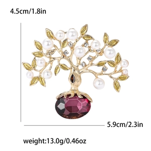 Broche Arbre de Vie dorée ornée de perles blanches, strass et une gemme de cristal violette