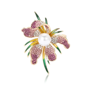Elegant gold alloy orchid brooch with pink purple rhinestones and white pearl on white background