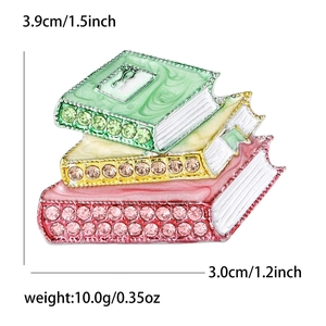 Broche créative en émail et strass en forme de livres avec dimensions et poids détaillés