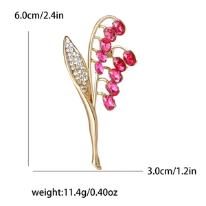 Elegante spilla a mughetto con gemme rosa e strass, dimensioni di 6,0 cm per 3,0 cm