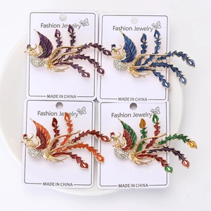 Detailed view of alloy enamel phoenix brooches with colorful rhinestones on display card