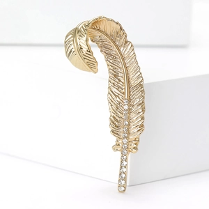 Elegant gold feather brooch with sparkling white rhinestones for suits and coats