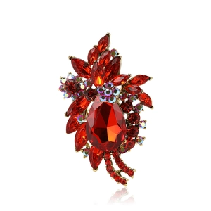 Vintage gold alloy bauhinia flower brooch with red faceted crystals and AB rhinestones
