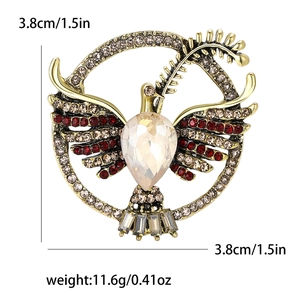 Detailed view of dove brooch with rhinestones showing dimensions 3.8cm and 11.6g weight