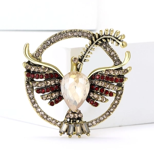 Detailed view of the dove brooch with champagne gemstones and intricate crystal settings