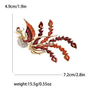 Elegant gold-tone phoenix brooch with red enamel and rhinestones, size 7.2x4.9 cm