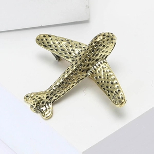 Polished gold alloy airplane brooch with black leopard spots for suits and coats