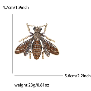 Detail view of rhinestone bee brooch with dimensions 5.6cm by 4.7cm and weight 23g