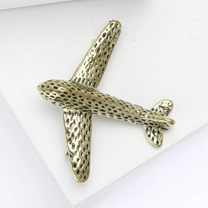 Polished alloy airplane brooch with honeycomb texture for suits and coats
