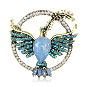 Elegant gold dove brooch with waterdrop blue crystal and sparkling rhinestones