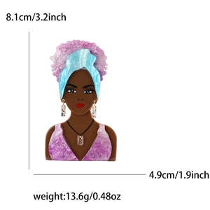 Acrylic Afro woman brooch with blue sequins and purple glitter, measuring 8.1cm by 4.9cm