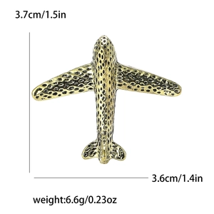 Polished vintage gold aircraft brooch with dimensions of 3.7cm and 3.6cm on white background