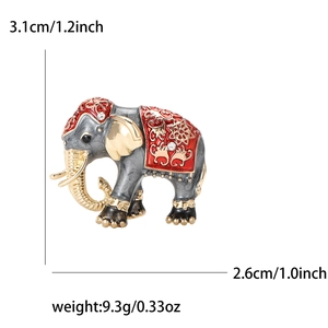 Vintage enamel elephant brooch in dark grey and gold with white rhinestones and red floral detail
