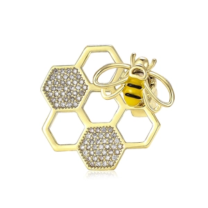Broche abeille dorée raffinée avec zircons et détails en émail jaune et noir