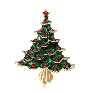 Broche sapin de Noël émaillée avec cristaux rouges et étoile dorée sur fond blanc