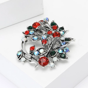 Vintage alloy wreath brooch with colorful rhinestones and antique silver finish