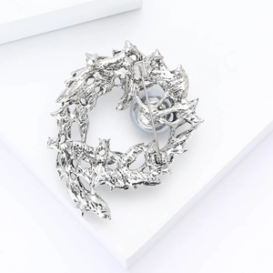 Detailed back view of the silver branch brooch showing the secure pin and alloy texture
