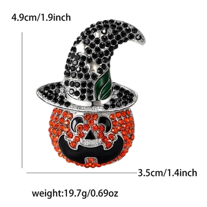 Detail showing Halloween pumpkin wizard brooch dimensions of 4.9cm height and 3.5cm width