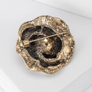 Retro gun black rose brooch with crystals, back view showing gold plating and safety pin clasp