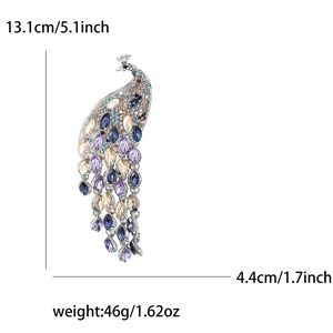 Tableau des tailles d'une luxueuse broche paon avec dimensions et poids précis