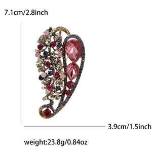 Detailed size specifications of a vintage rhinestone leaf brooch with height and weight