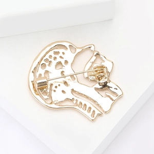 Detailed back view of golden alloy hollow brooch showing the secure pin fastener