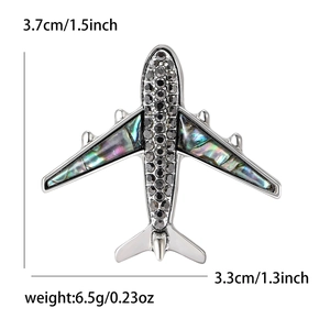 Broche avion mode en alliage avec nacre d'abalone et strass noirs, taille 3.7cm x 3.3cm