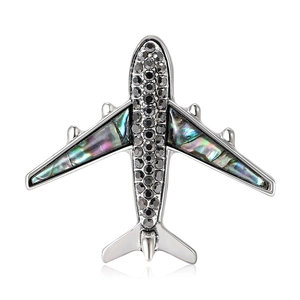 Broche avion tendance en alliage avec cristaux noirs et incrustations de nacre irisée