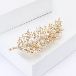 Exquisite gold leaf brooch featuring white pearls on creative branch design for women