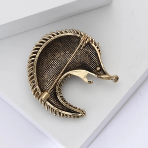 Macro shot showing the back structure and pin clasp of the hedgehog brooch