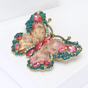 Elegant vintage gold butterfly brooch with colorful rhinestones and purple textured wings