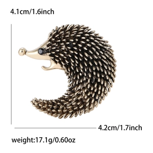 Retro hedgehog alloy brooch pin with enamel finish and detailed spike textures on white background