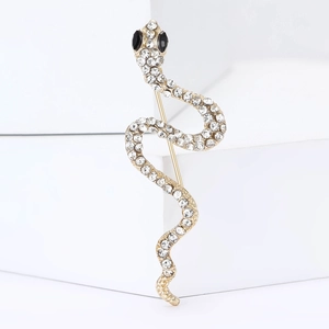Exquise broche serpent dorée avec des strass étincelants et des yeux en pierre noire
