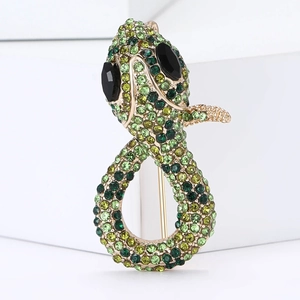 Chic snake brooch with green gradient crystals and black gem eyes on golden alloy base