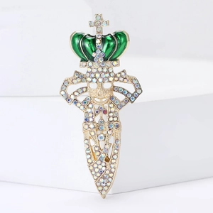 Gothic crown skull sword brooch with colorful rhinestones on a white podium