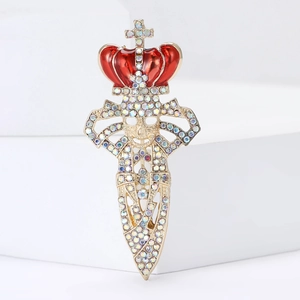 Gothic gold crown skull sword brooch with rainbow rhinestones on minimalist white block