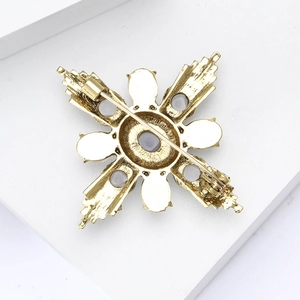 Detailed back view of vintage gold alloy brooch featuring secure safety pin and antique texture